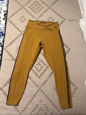 Puma ladies mustard Leggings with Black Side Stripes